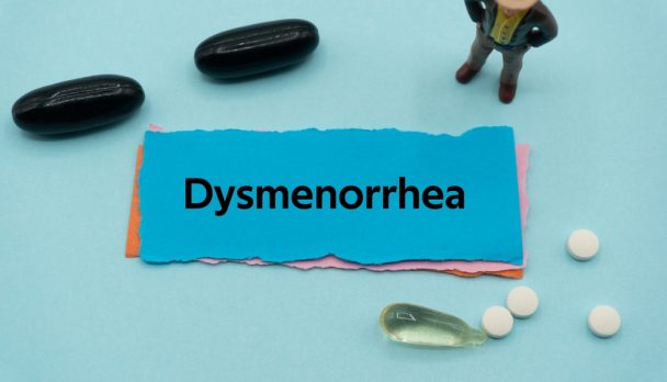 Dysmenorrhea.the,Word,Is,Written,On,A,Slip,Of,Colored,Paper.