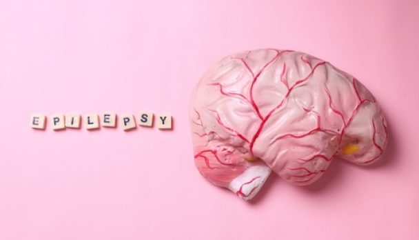 Brain,With,Epilepsy,Lettering,On,Blocks,Isolated,On,Pink,Background.